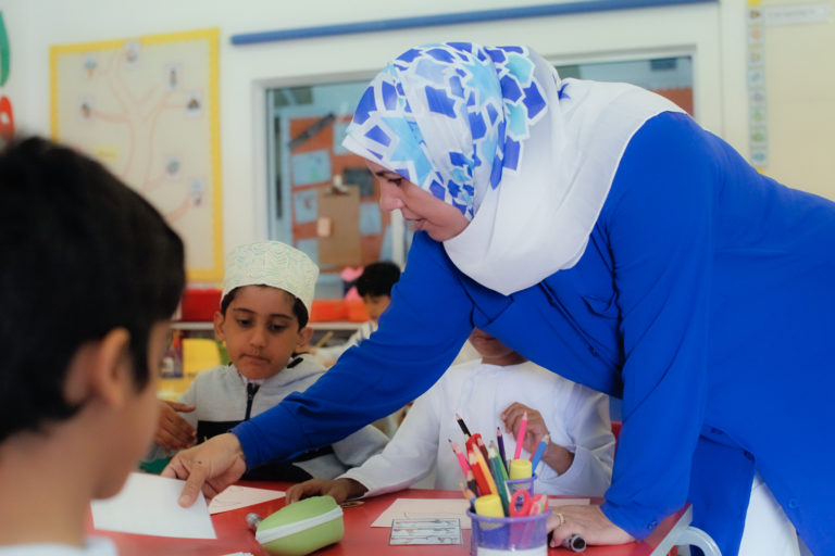 teacher with students in classroom